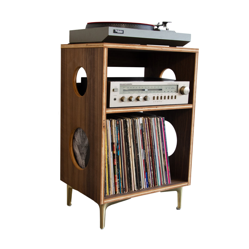 Wooden record player console with vinyl records and stereo equipment on a white background