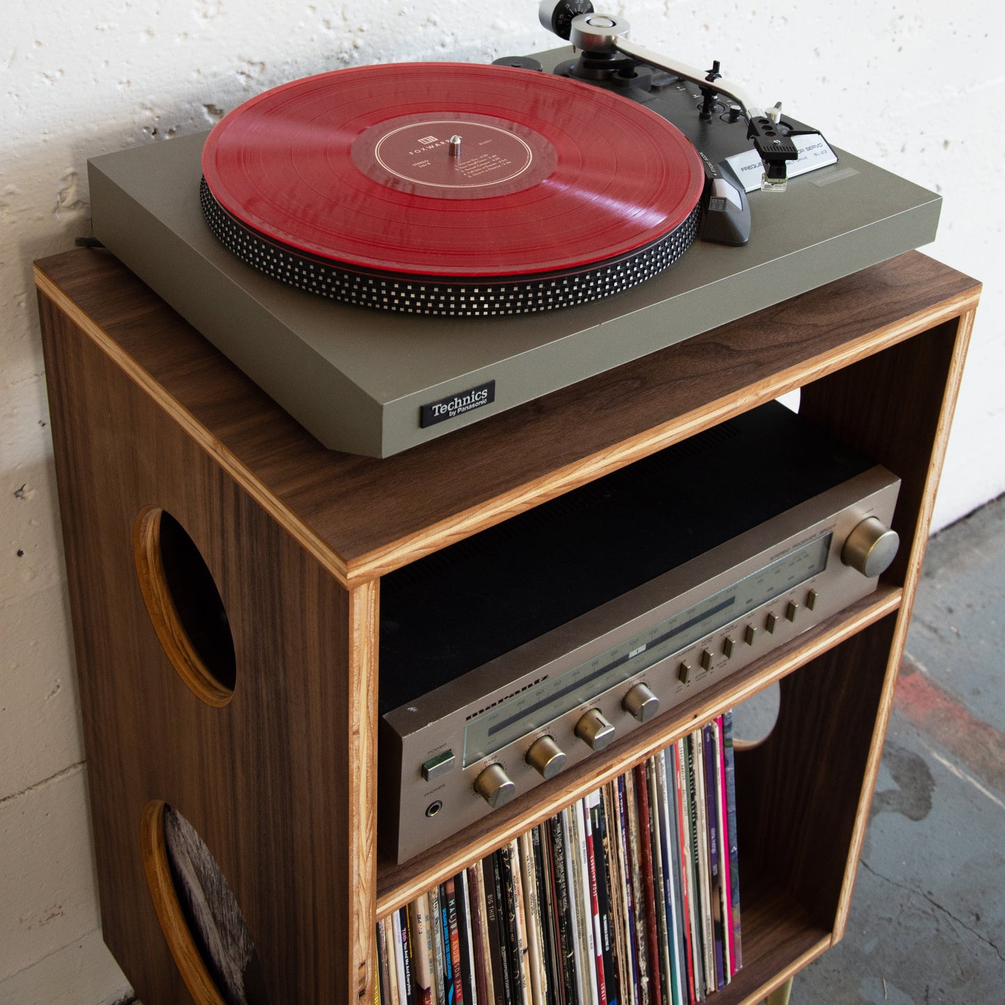 Wooden walnut vinyl record cabinet with turntable. white background