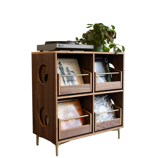 Wooden record cabinet with decorative items on a white background