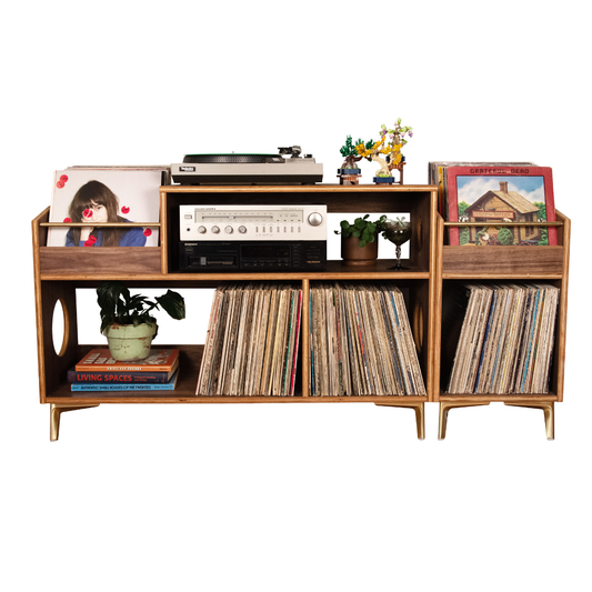 A mid-century modern wooden record rack shelf with gold-tone legs, styled with vinyl records, a turntable, a radio receiver, potted plants, and books against a plain white background.