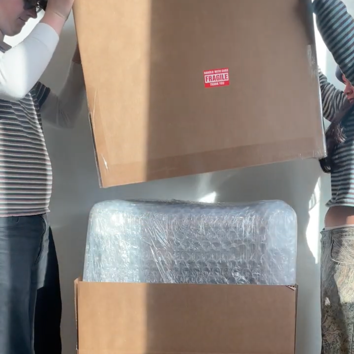 people unboxing sidetracked cabinet