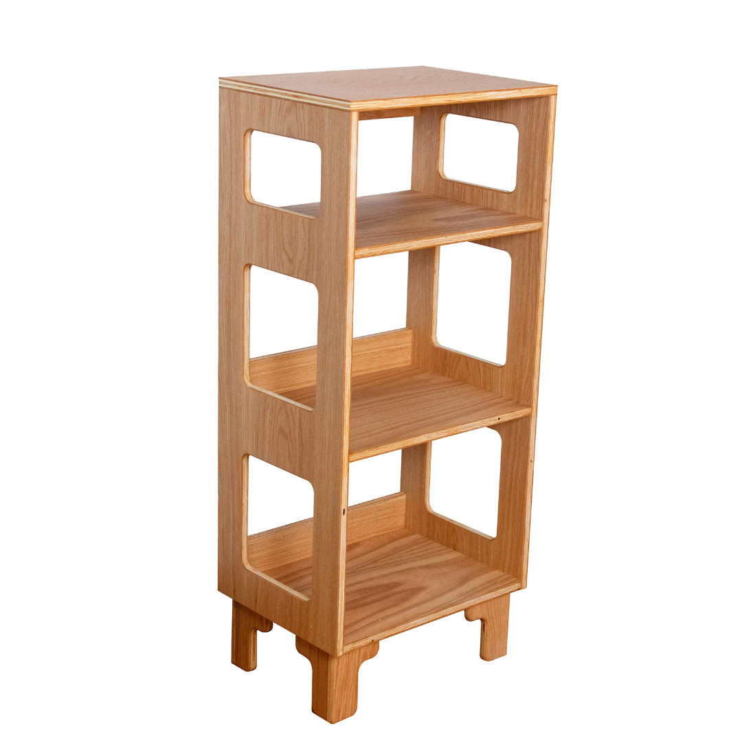 A light natural wood three-tier shelving unit with a modern minimalist design, featuring cutout side panels and tapered legs, shown on a solid white background.