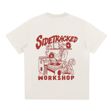 Load image into Gallery viewer, White t-shirt with red graphic and text &#39;Sidetracked Workshop&#39; on a white background
